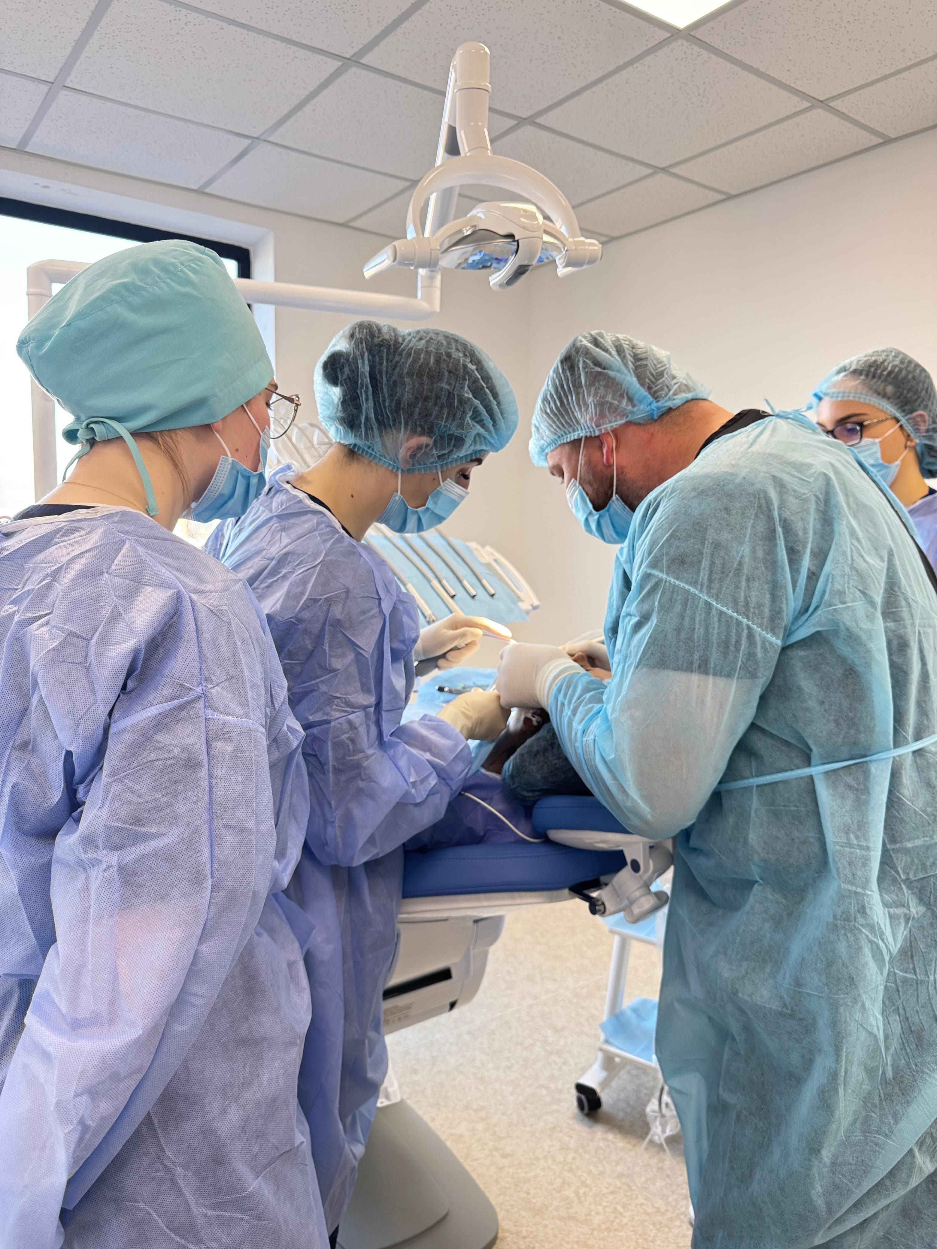 Komi Dental Center doctors during a clinical procedure